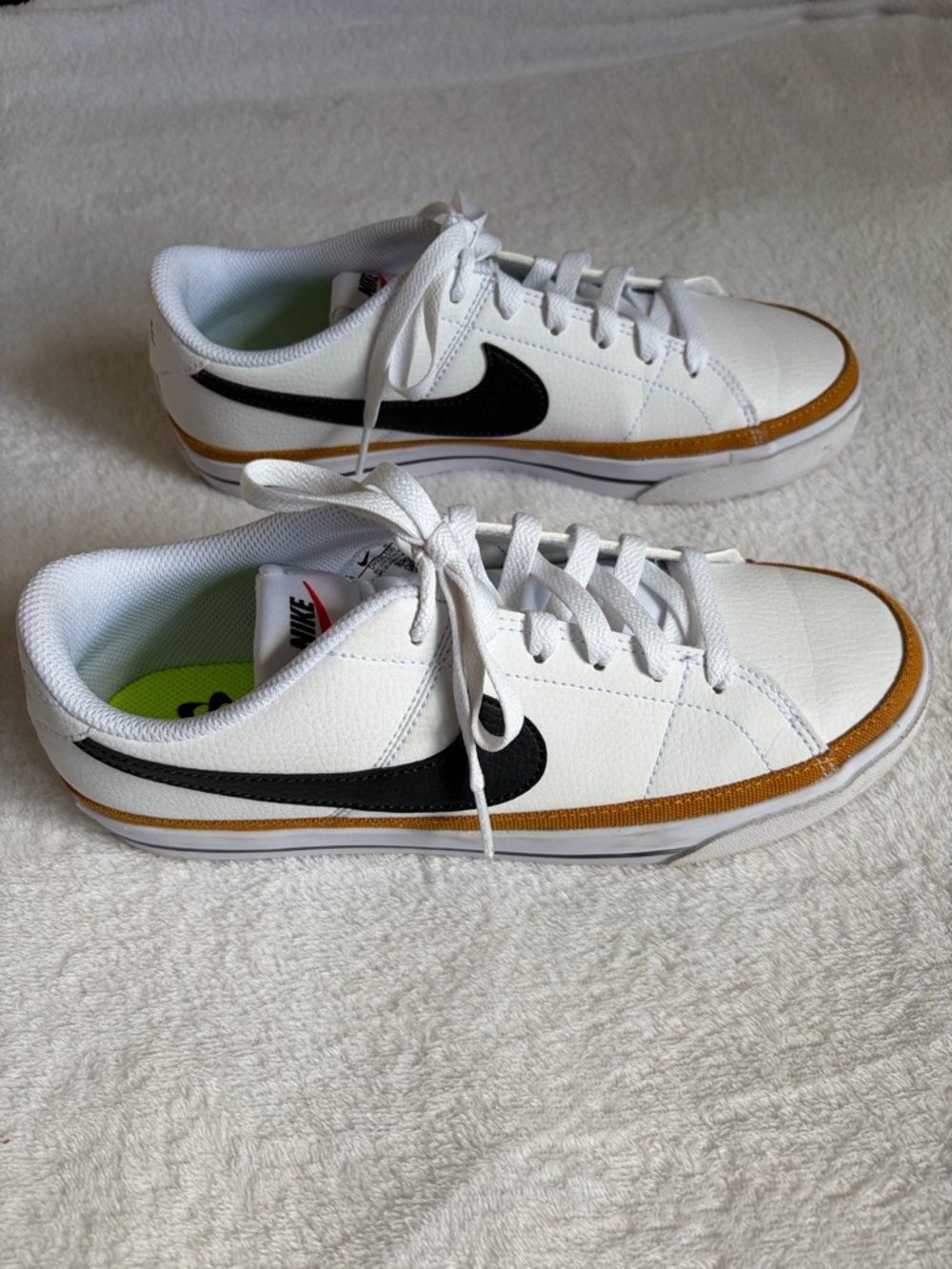 Nike White Sneakers with Black Swoosh and Brown Trim